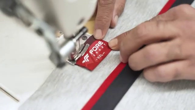 Quality detail on a Fore Offical garment label